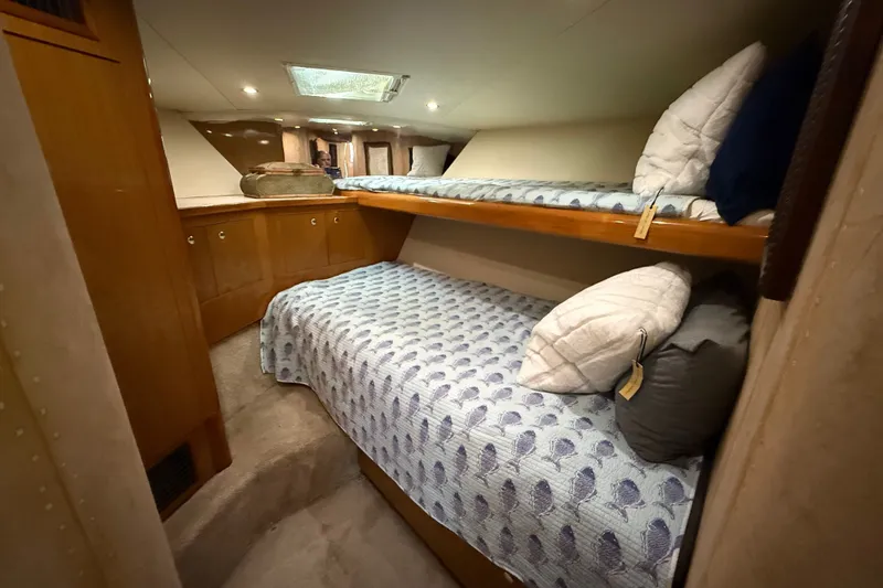 Slide: The Image of Interior of 2002 Viking 52 Convertible yacht with cozy twin bunk beds. - 34