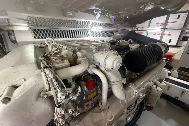 Slide: The Image of Engine room of a 2002 Viking 52 Convertible yacht, showcasing detailed machinery. - 48