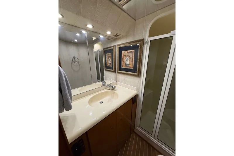 Slide: The Image of Bathroom interior of 2002 Viking 52 Convertible yacht with sink and shower. - 31