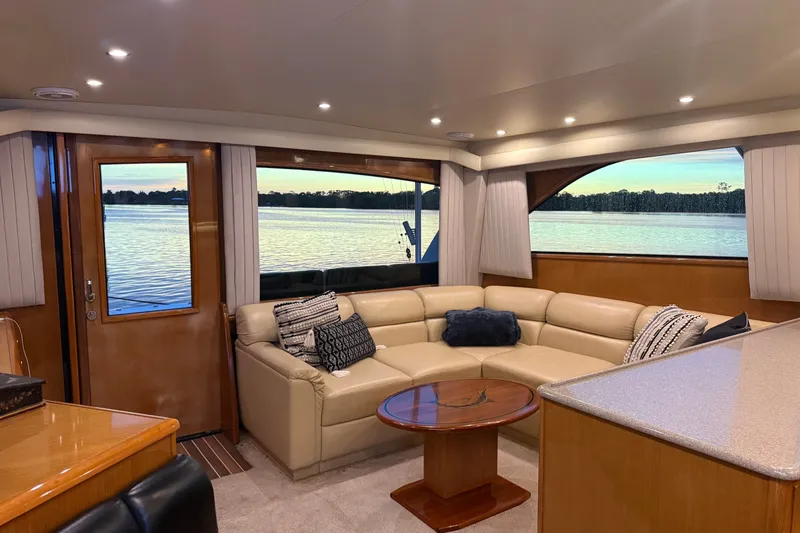 Slide: The Image of Luxurious interior of a 2002 Viking 52 Convertible yacht with scenic water view. - 19