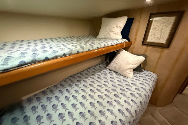 Slide: The Image of Bunk beds with fish-patterned bedding in 2002 Viking 52 Convertible yacht cabin. - 36