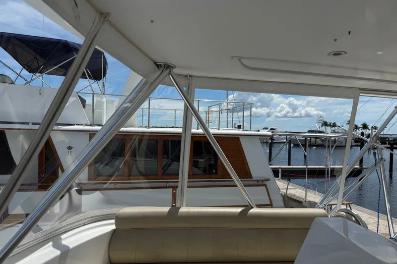 Slide: The Image of Interior view of a 2002 Viking 52 Convertible yacht at a marina. - 18