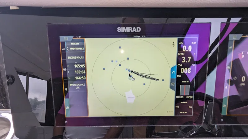 Slide: The Image of Simrad navigation system on a Sea Ray Sundancer 320 Outboard, displaying course and speed. - 30