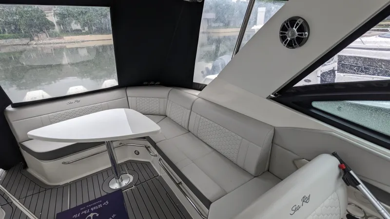 Slide: The Image of Interior of a Sea Ray Sundancer 320 Outboard with elegant seating area and table. - 4