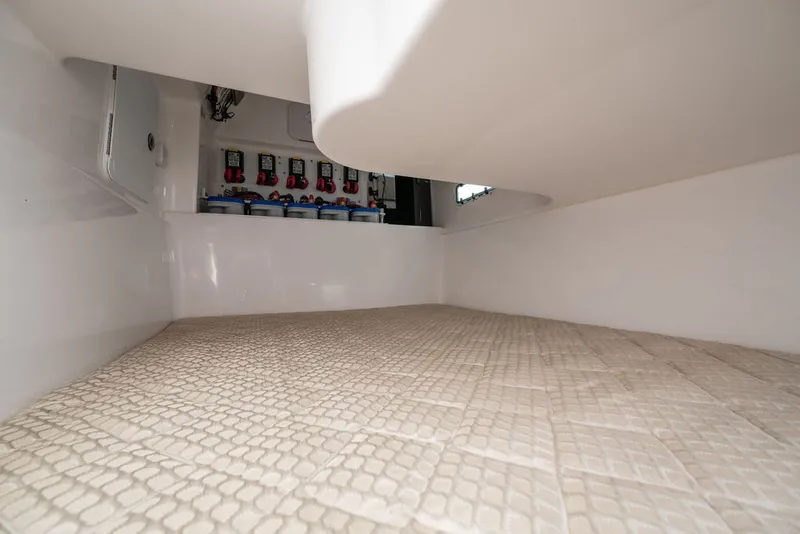 Slide: The Image of Interior of a 2019 Everglades 350LX with padded flooring and electrical connections. - 31