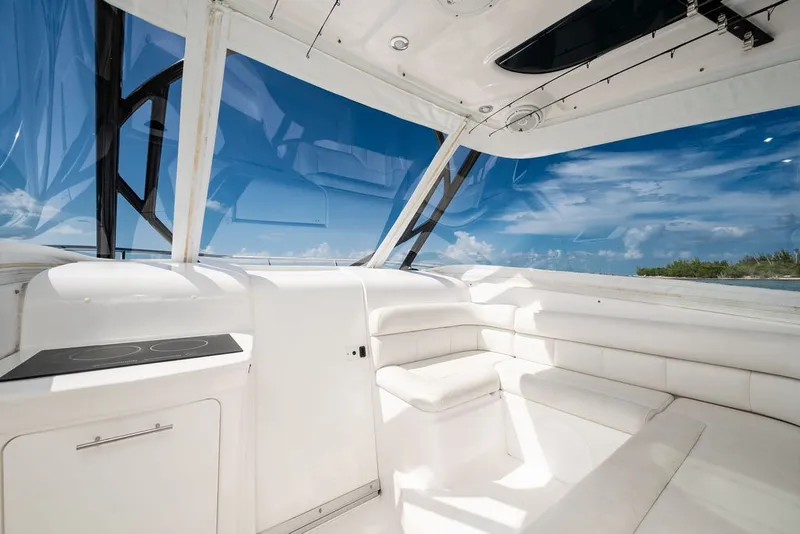 Slide: The Image of The image shows the bright, modern cockpit of a 2019 Everglades 350LX with white upholstery. - 16