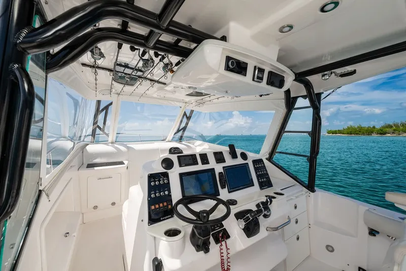Slide: The Image of The image shows the cockpit of a 2019 Everglades 350LX with modern electronics. - 14