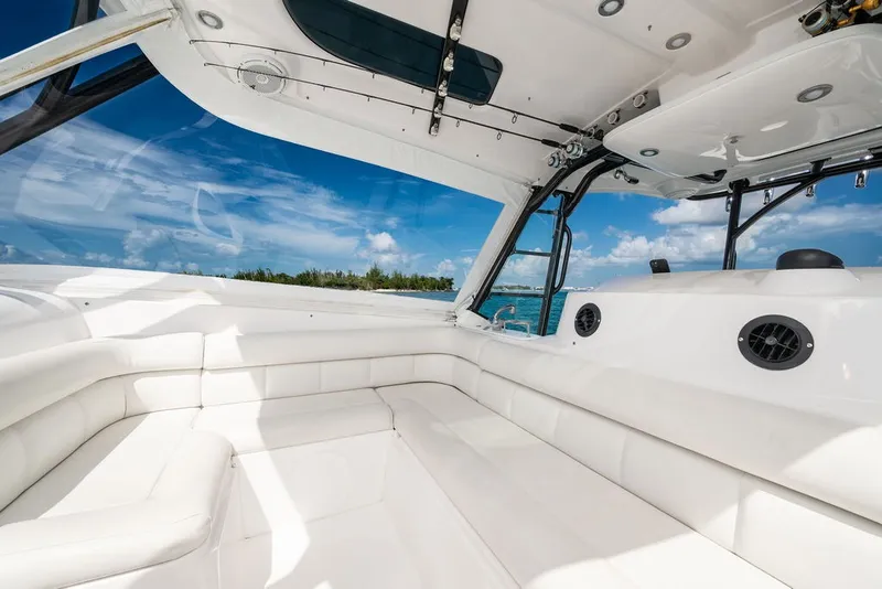 Slide: The Image of The image shows the spacious white cockpit of a 2019 Everglades 350LX with blue sky in the background. - 18