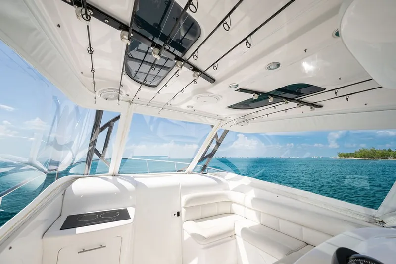Slide: The Image of The image shows the cockpit of a 2019 Everglades 350LX with a view of the sea. - 15