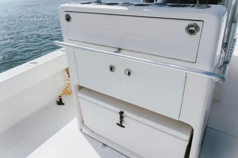 Slide: The Image of 2014 SeaVee 320B boat deck with storage compartments and ocean view. - 20