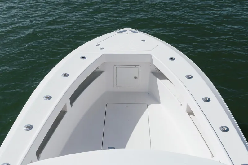Slide: The Image of Bow view of 2014 SeaVee 320B boat on water. - 18