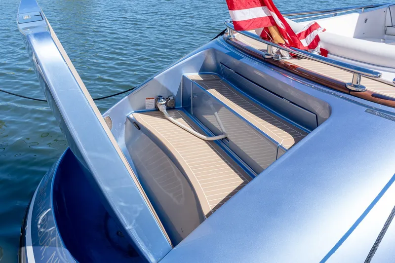 Slide: The Image of 2014 Zeelander Z44 yacht stern with American flag, featuring sleek design and luxurious deck. - 16
