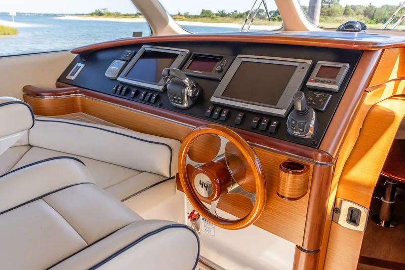 Slide: The Image of Luxurious 2014 Zeelander Z44 yacht helm with wood accents and modern navigation equipment. - 34