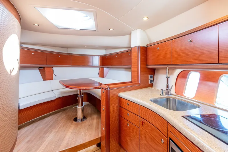 Slide: The Image of Luxurious 2014 Zeelander Z44 yacht interior with modern kitchen and elegant seating area. - 45