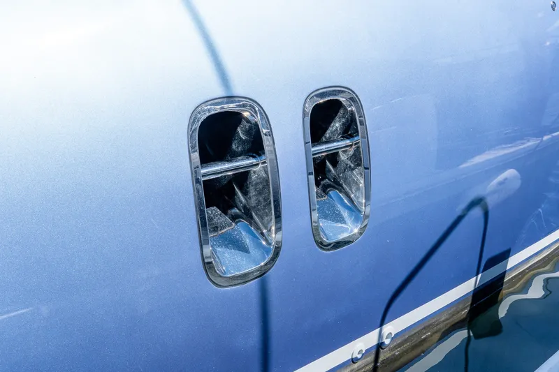Slide: The Image of Close-up of 2014 Zeelander Z44 yacht's chrome exhaust vents on blue hull. - 17