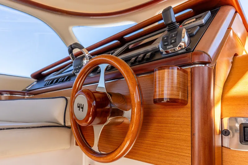 Slide: The Image of Luxurious 2014 Zeelander Z44 yacht interior with elegant wooden steering wheel and controls. - 39