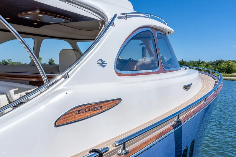 Slide: The Image of 2014 Zeelander Z44 luxury yacht with sleek design on calm water. - 3