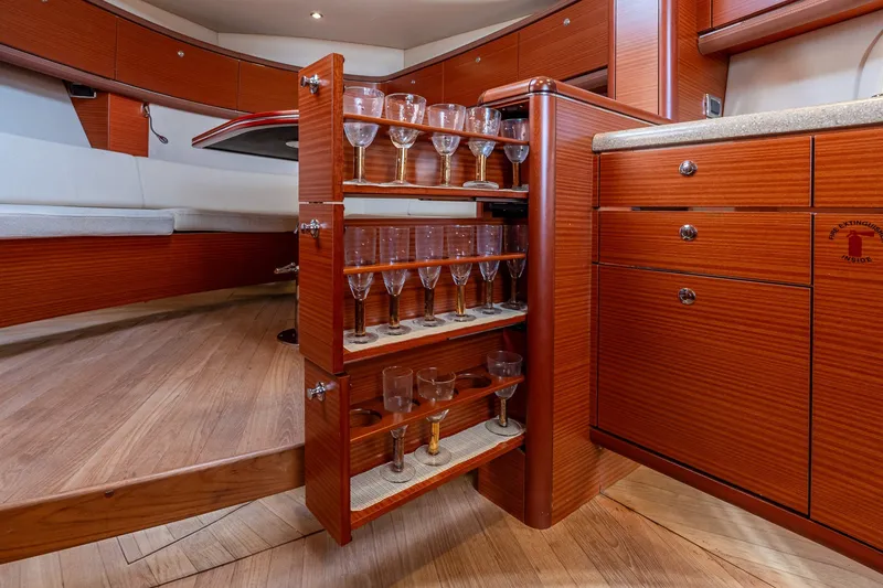 Slide: The Image of Luxurious interior of 2014 Zeelander Z44 yacht with elegant wooden cabinetry and glassware storage. - 51