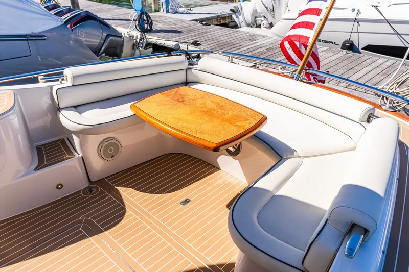 Slide: The Image of Luxurious 2014 Zeelander Z44 yacht with elegant seating and wooden table on deck. - 26