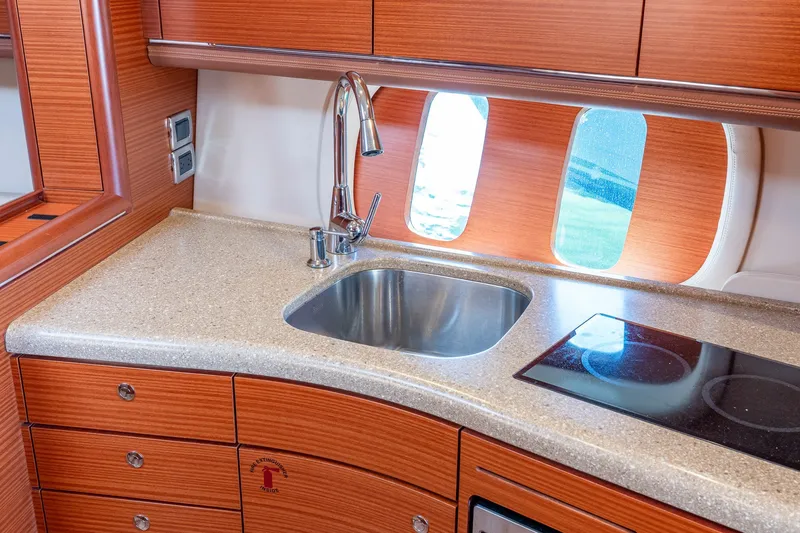 Slide: The Image of Luxurious 2014 Zeelander Z44 yacht kitchen with sleek wood cabinetry and modern appliances. - 47