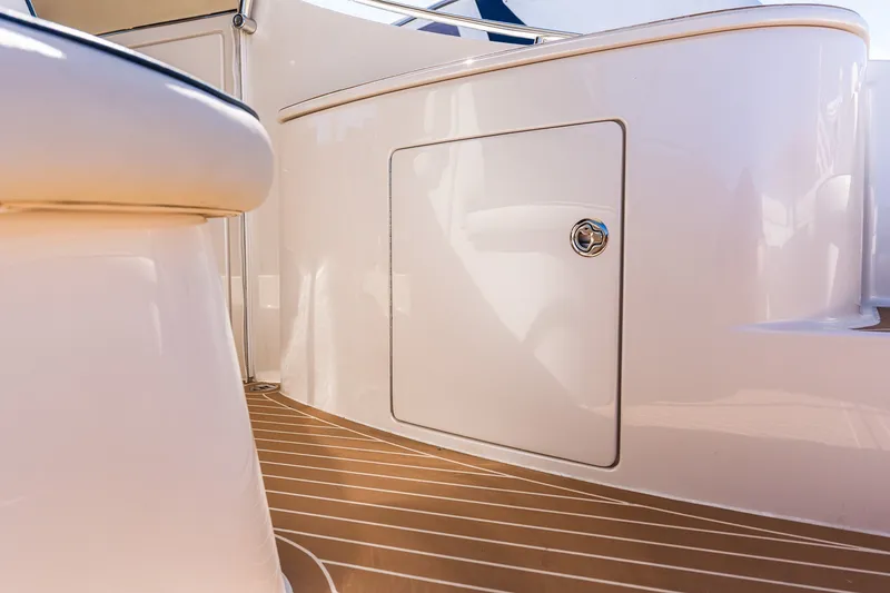 Slide: The Image of Interior view of 2014 Zeelander Z44 yacht, featuring sleek white cabinetry and wood flooring. - 28