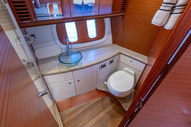 Slide: The Image of Luxurious bathroom interior of 2014 Zeelander Z44 yacht with modern fixtures and wooden accents. - 54