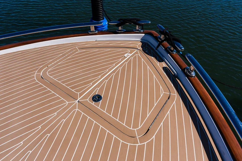 Slide: The Image of Deck of 2014 Zeelander Z44 yacht with teak finish and stainless steel fittings. - 23