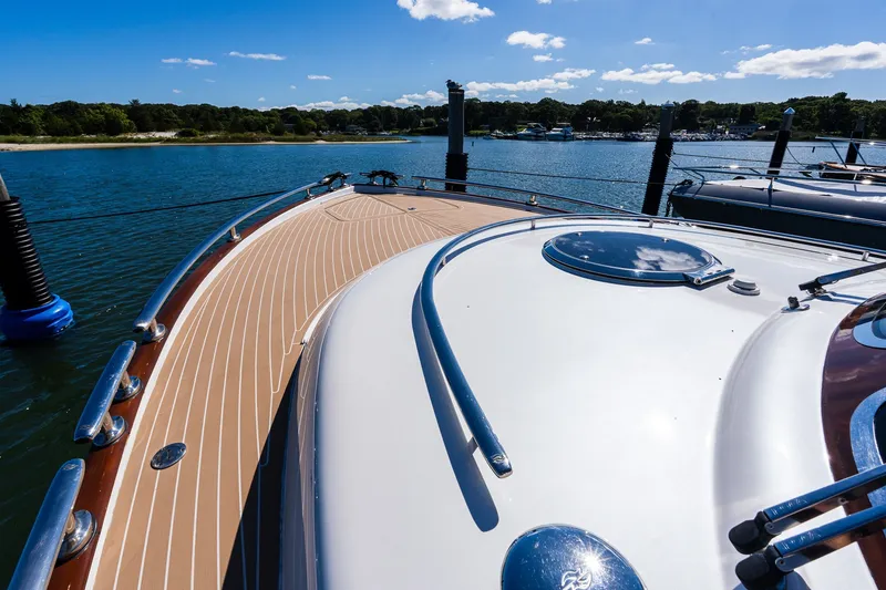 Slide: The Image of 2014 Zeelander Z44 yacht deck with sleek design, docked in sunny marina. - 18