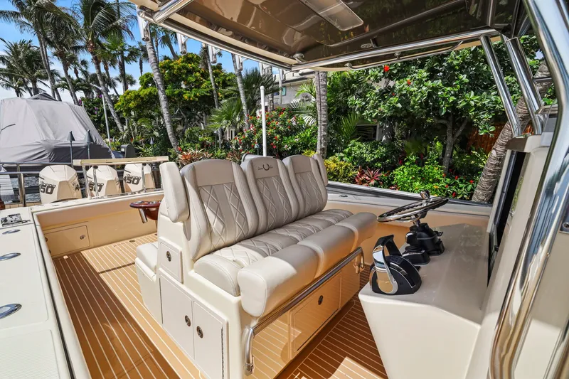 Slide: The Image of Luxurious 2013 Bahama 41 boat interior with plush seating and modern controls. - 21