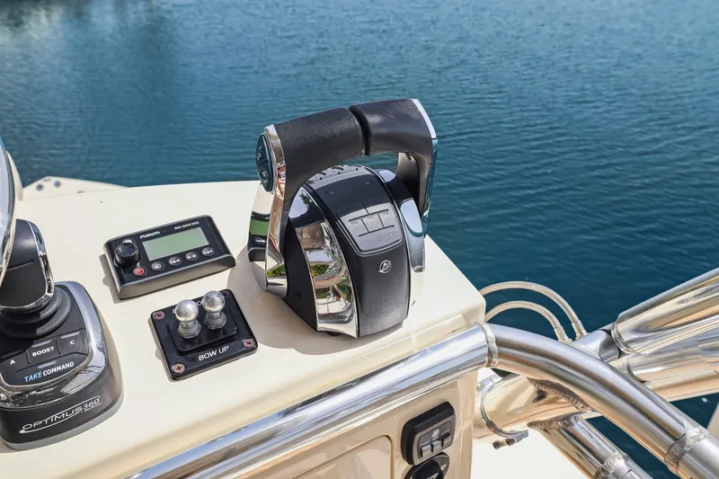 Slide: The Image of Control panel of a 2013 Bahama 41 boat with throttle and navigation equipment. - 43
