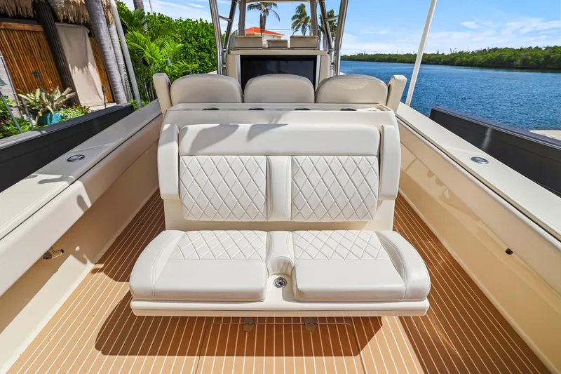 Slide: The Image of Luxurious seating on a 2013 Bahama 41 boat with elegant diamond-pattern upholstery. - 27