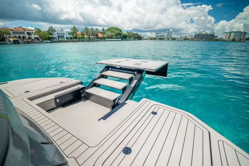 Slide: The Image of Luxury Maori 46ft yacht with retractable swim platform, 2024 model, on turquoise water. - 35
