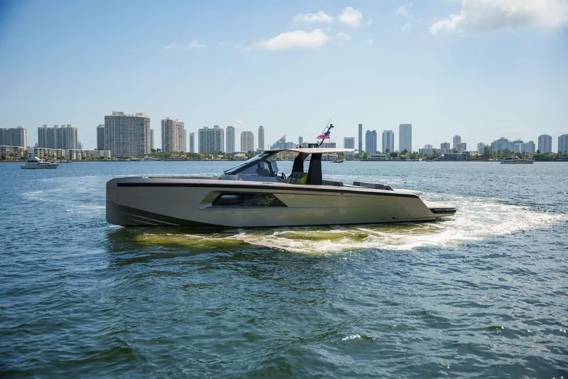 Slide: The Image of 2024 Maori 46ft yacht cruising near city skyline on a sunny day. - 41