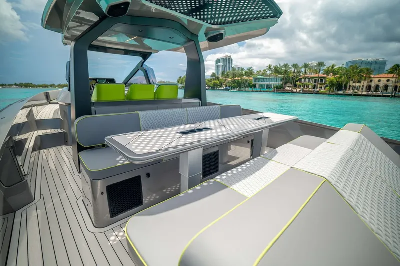 Slide: The Image of Luxurious 2024 Maori 46ft yacht interior with modern seating and scenic waterfront view. - 27