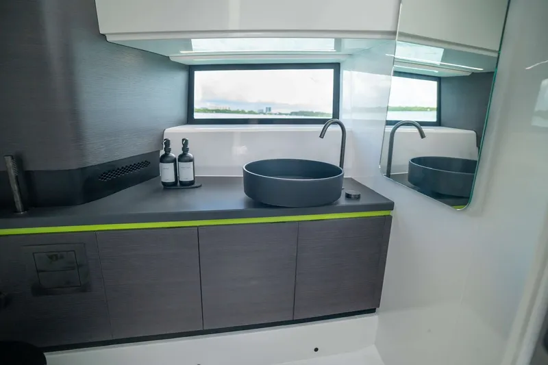 Slide: The Image of Modern bathroom interior on 2024 Maori 46ft yacht, featuring sleek sink and cabinetry. - 40