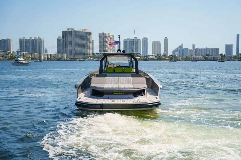 Slide: The Image of 2024 Maori 46ft yacht cruising near city skyline on a sunny day. - 42