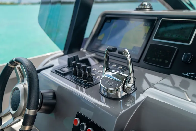 Slide: The Image of Cockpit of 2024 Maori 46ft yacht with modern controls and steering wheel. - 18