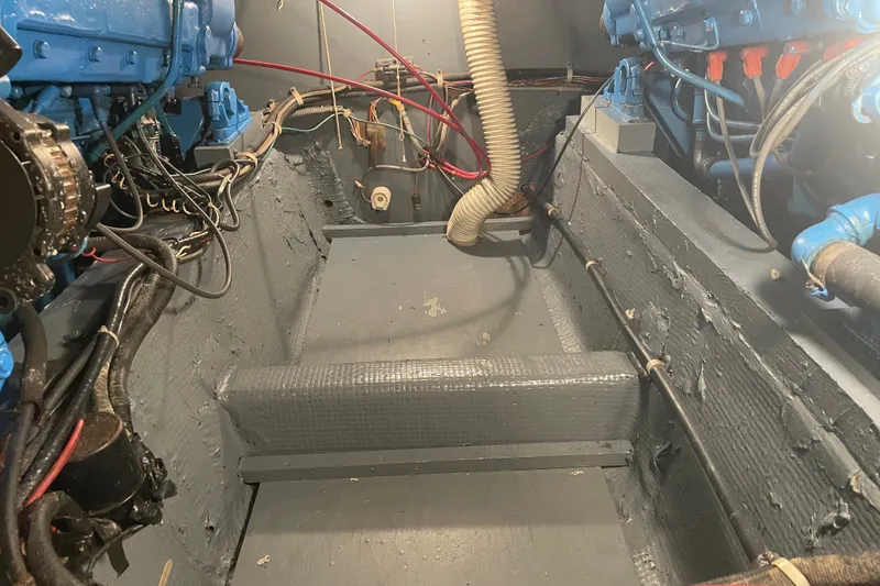 Slide: The Image of Engine room of a 1974 Chris-Craft 350 Catalina boat with visible wiring and components. - 11