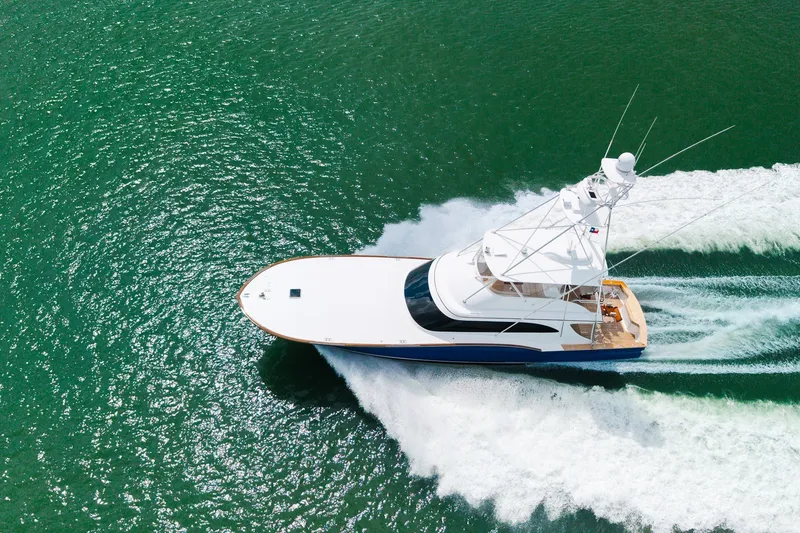 Slide: The Image of Aerial view of 2008 B&D Convertible yacht cruising on green ocean waters. - 3