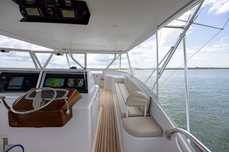 Slide: The Image of Helm of 2008 B&D Convertible yacht with navigation screens and ocean view. - 59