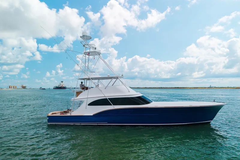 Slide: The Image of A 2008 B&D Convertible yacht cruising on a sunny day with blue skies. - 10