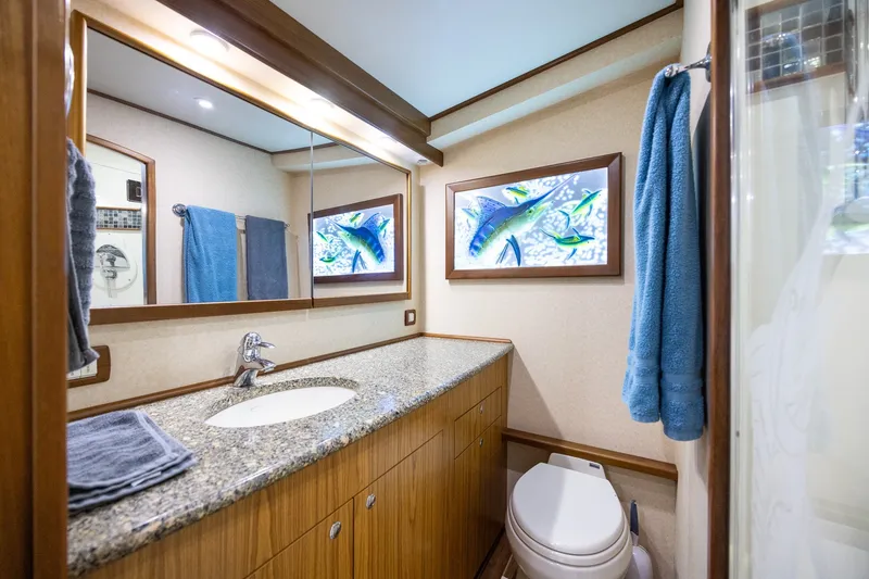 Slide: The Image of Luxurious 2008 B&D Convertible bathroom with granite countertop and marine-themed artwork. - 38