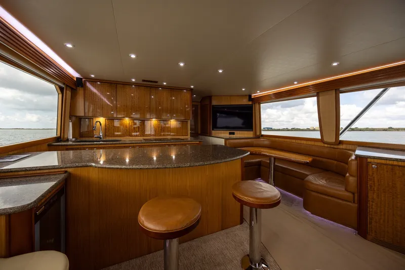 Slide: The Image of Luxurious 2008 B&D Convertible yacht interior with modern kitchen and seating area. - 27