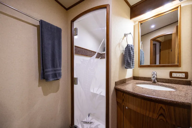 Slide: The Image of Luxurious bathroom in 2008 B&D Convertible yacht with elegant wood accents and modern fixtures. - 44