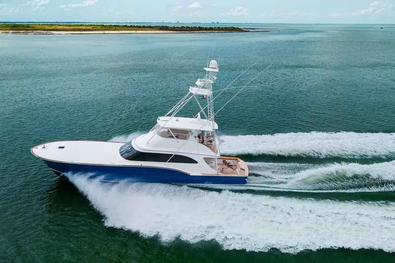 Slide: The Image of A 2008 B&D Convertible yacht cruising swiftly on open water. - 4