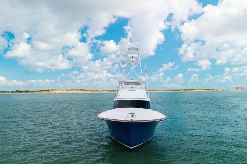 Slide: The Image of 2008 B&D Convertible yacht on open water under a bright blue sky. - 9