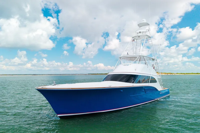 The Image of Luxurious 2008 B&D Convertible yacht cruising on a sunny day with blue skies. - 7