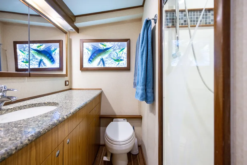 Slide: The Image of Luxurious 2008 B&D Convertible bathroom with granite countertop and vibrant fish artwork. - 39