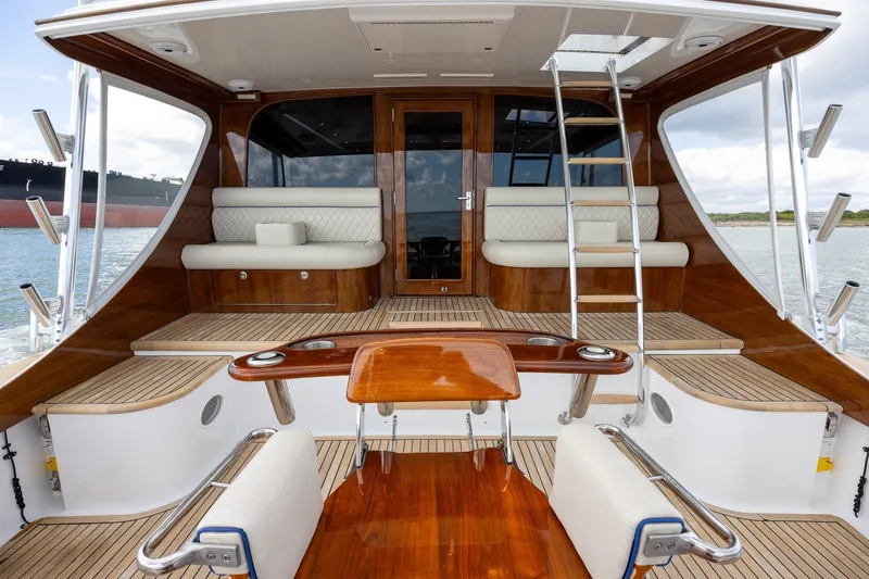 Slide: The Image of Luxurious 2008 B&D Convertible yacht interior with polished wood and cushioned seating. - 13