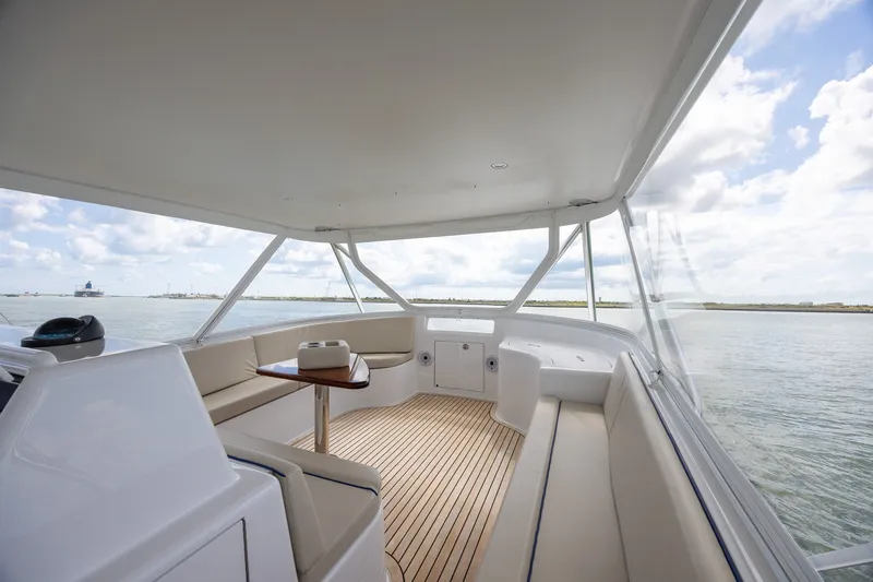 Slide: The Image of Luxurious 2008 B&D Convertible yacht interior with spacious seating and ocean view. - 60